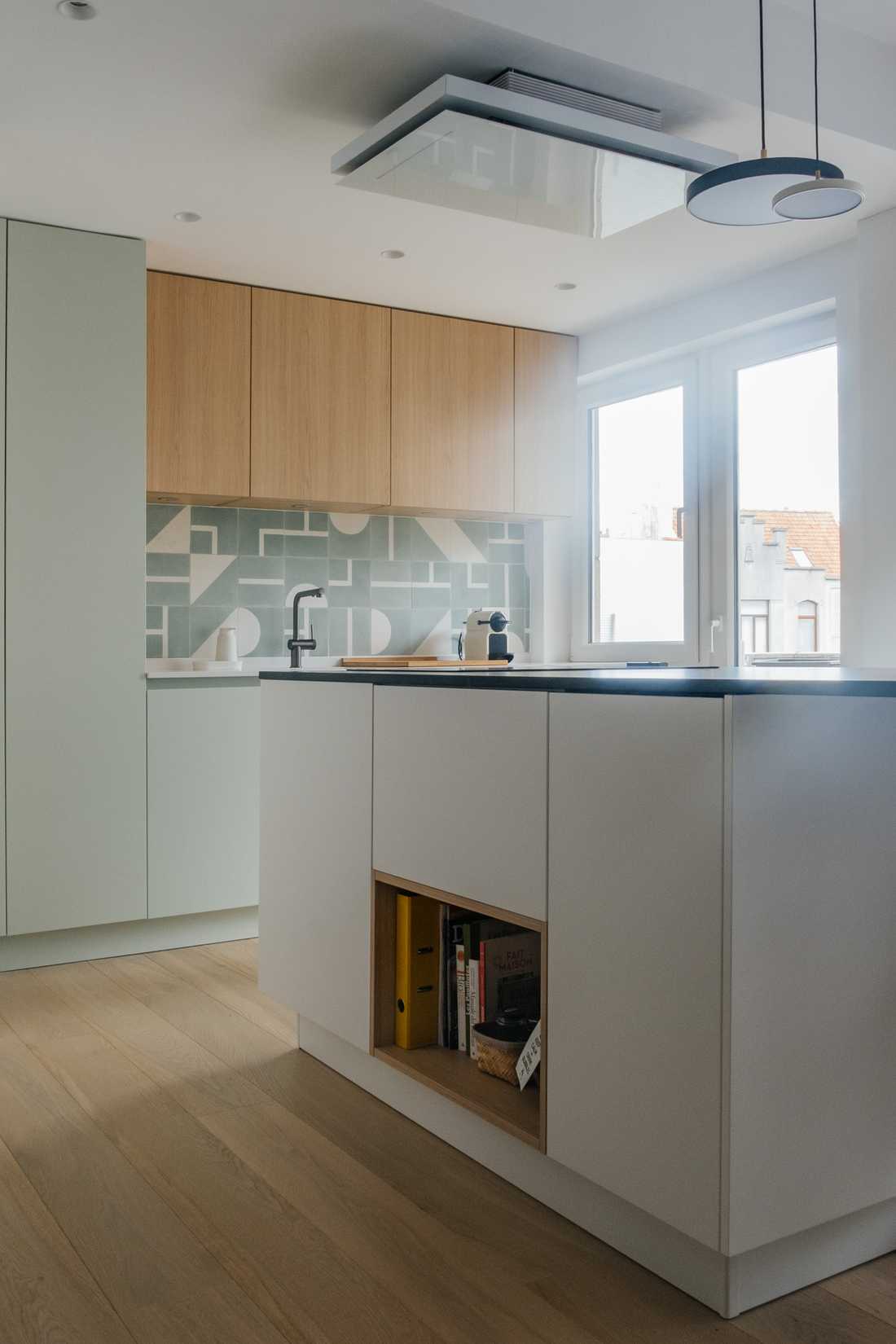 Rénovation de la cuisine de l'appartement avec un ilot central